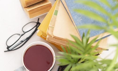 books-arrangement-with-cup-glasses