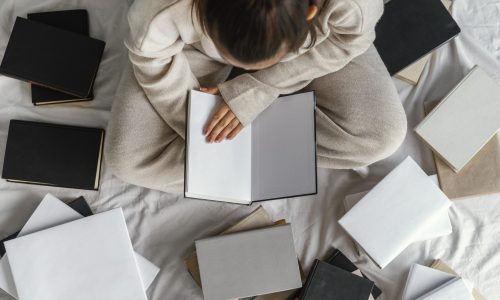 close-up-student-bed-with-books-top-view