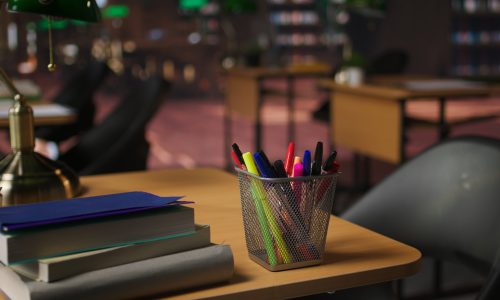 Empty academic setting combines historical charm with elegant study desks, serene lighting and a formal workspace. Vintage space offering a peaceful and inspiring atmosphere for research.