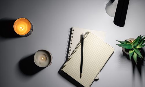 Flat lay, notepad and lamp, night workspace at home, deadline.