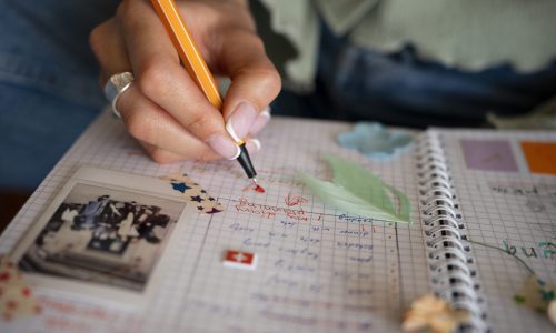 front-view-woman-doing-creative-journaling