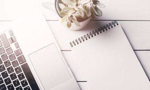 laptop-notepad-composition-desk