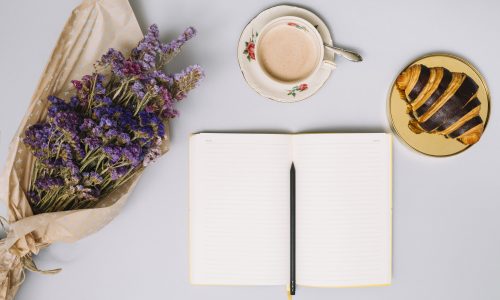 notebook-with-flowers-bouquet-croissant