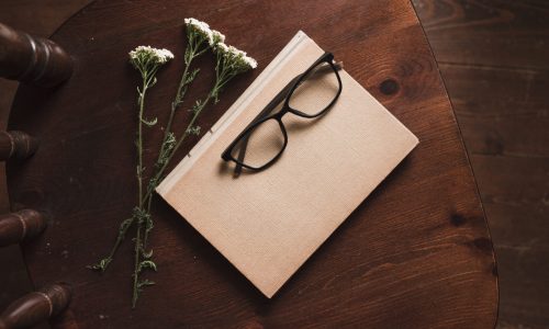 top-view-book-flowers-glasses