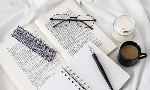 top-view-bookmark-coffee-cup-assortment