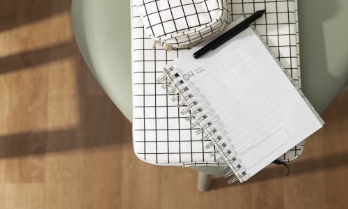 top-view-notebook-green-chair